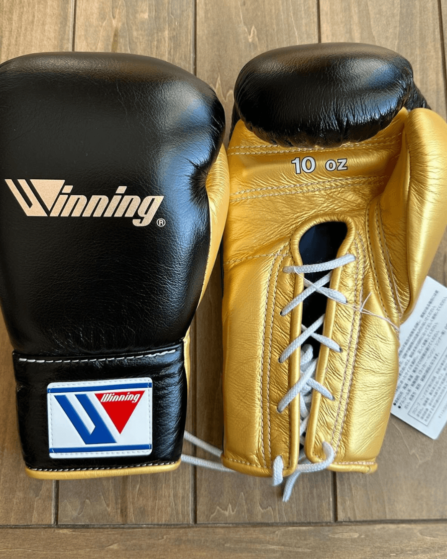 Winning Black/Gold Lace-Up Boxing Gloves Close Up Detail