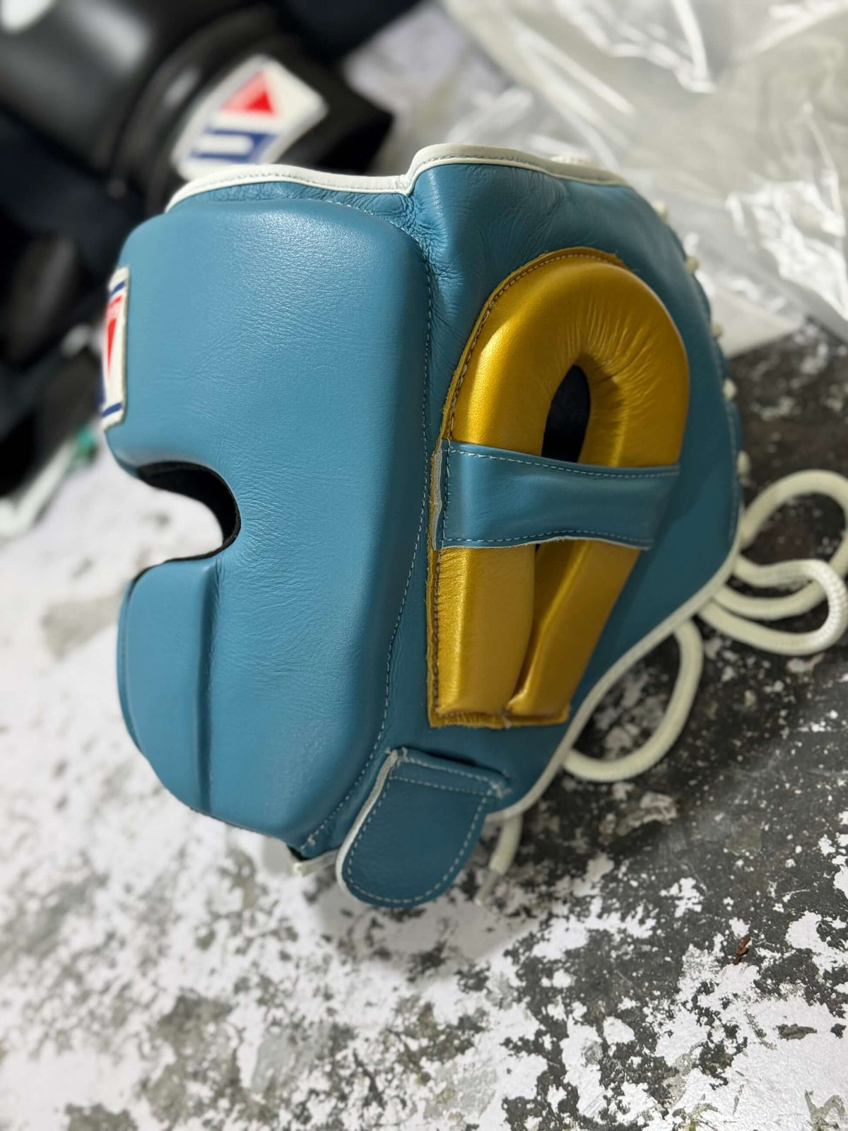 Winning Boxing Headgear Sky-Blue/Gold Leather Head Guard for Training Side View