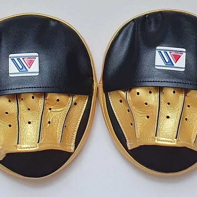 Winning Boxing Mitts Black/Gold Curved Premium Leather Focus Mitts Front View